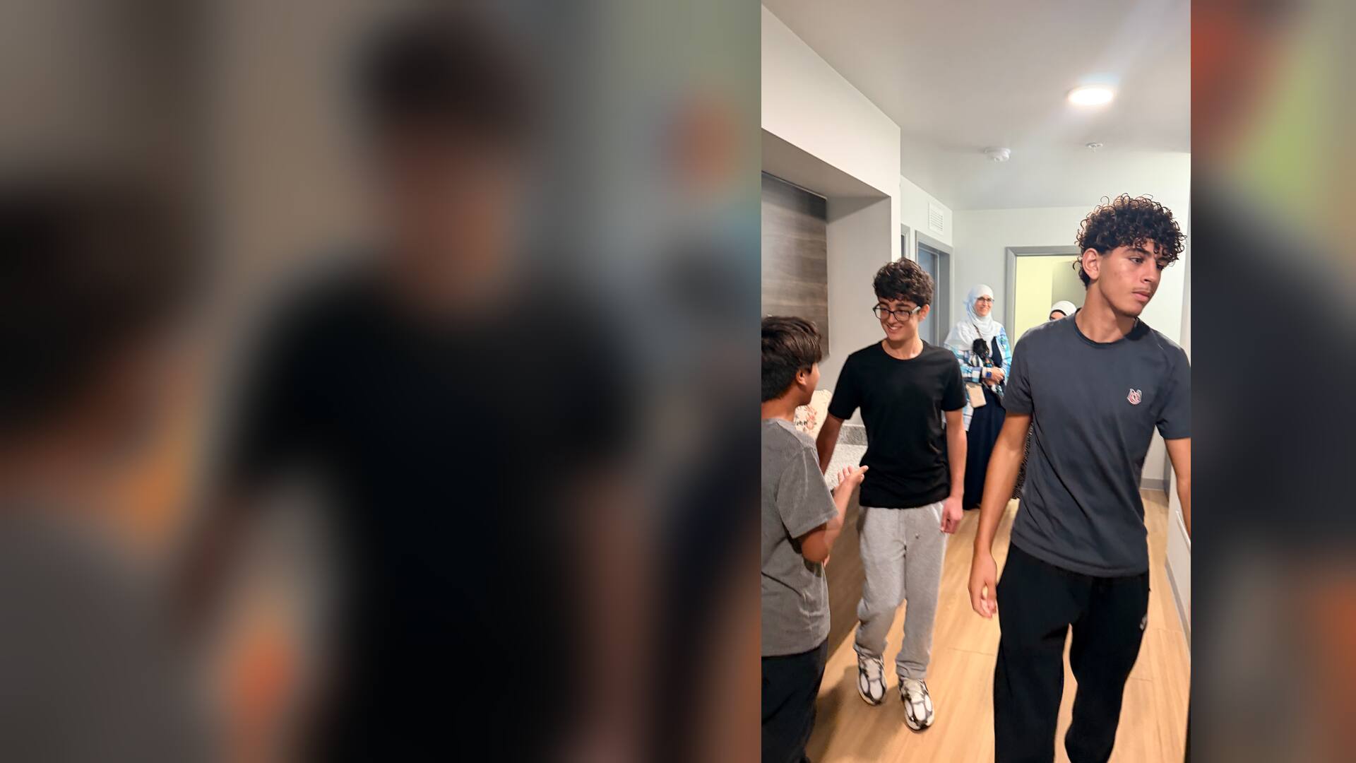 Students exploring a residence hall suite