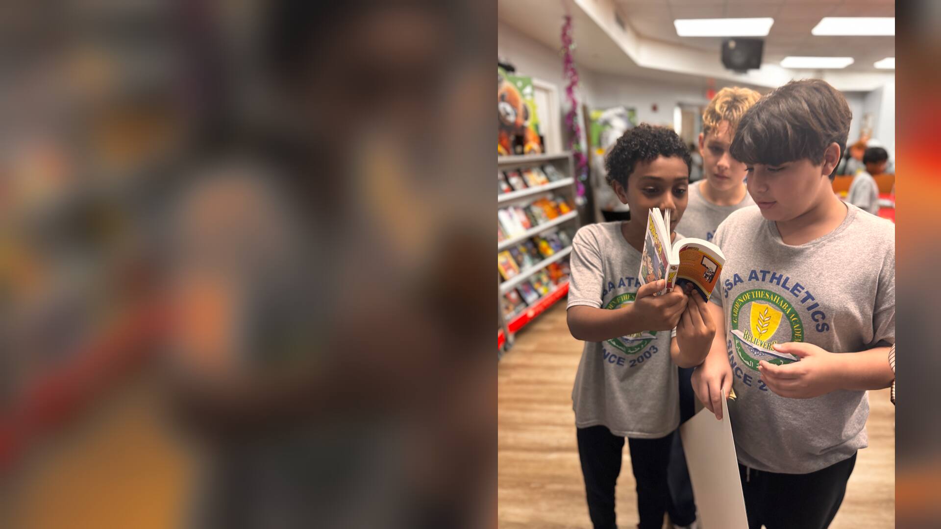 Students looking at a book together