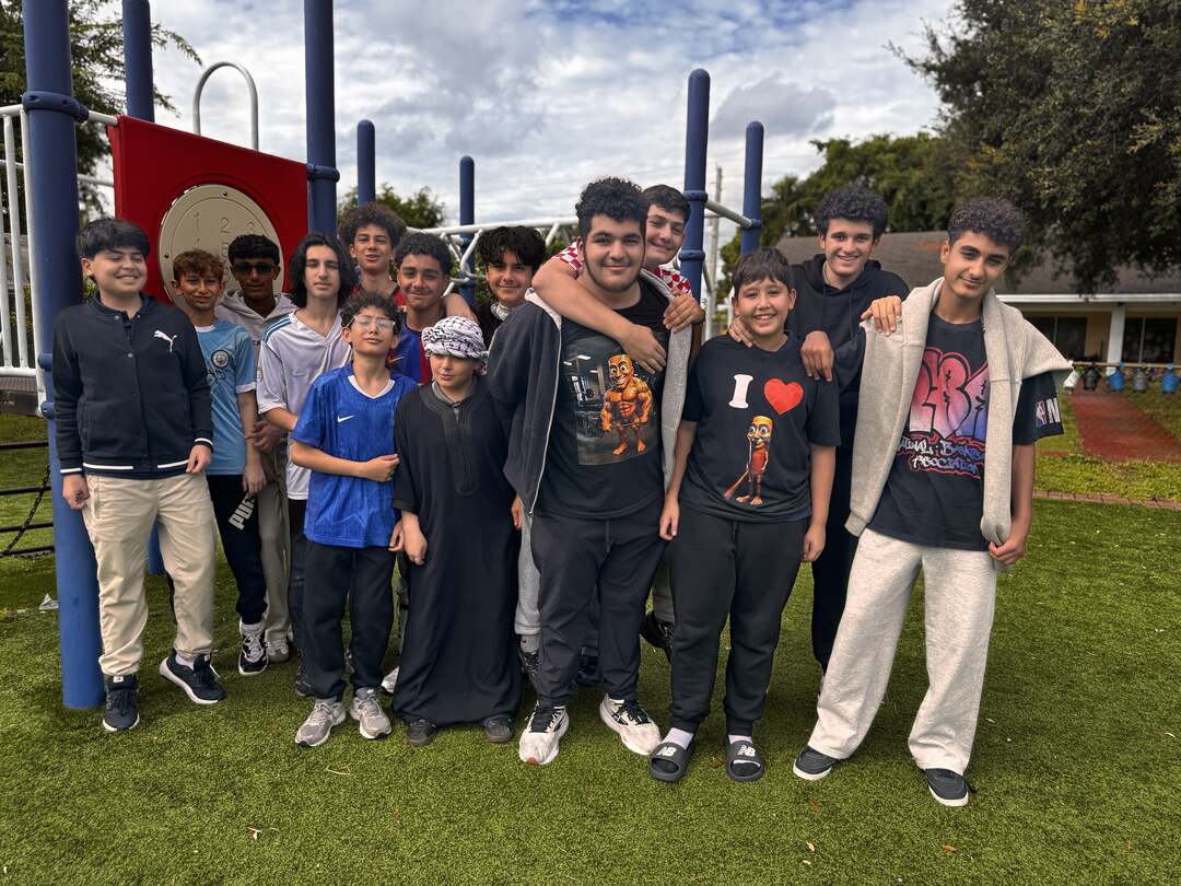 A big group of students all smiles in their favorite casual outfits on Dress Down Day
