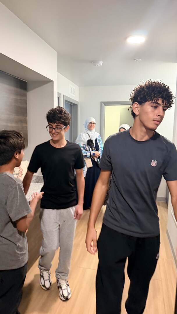 Students exploring a residence hall suite