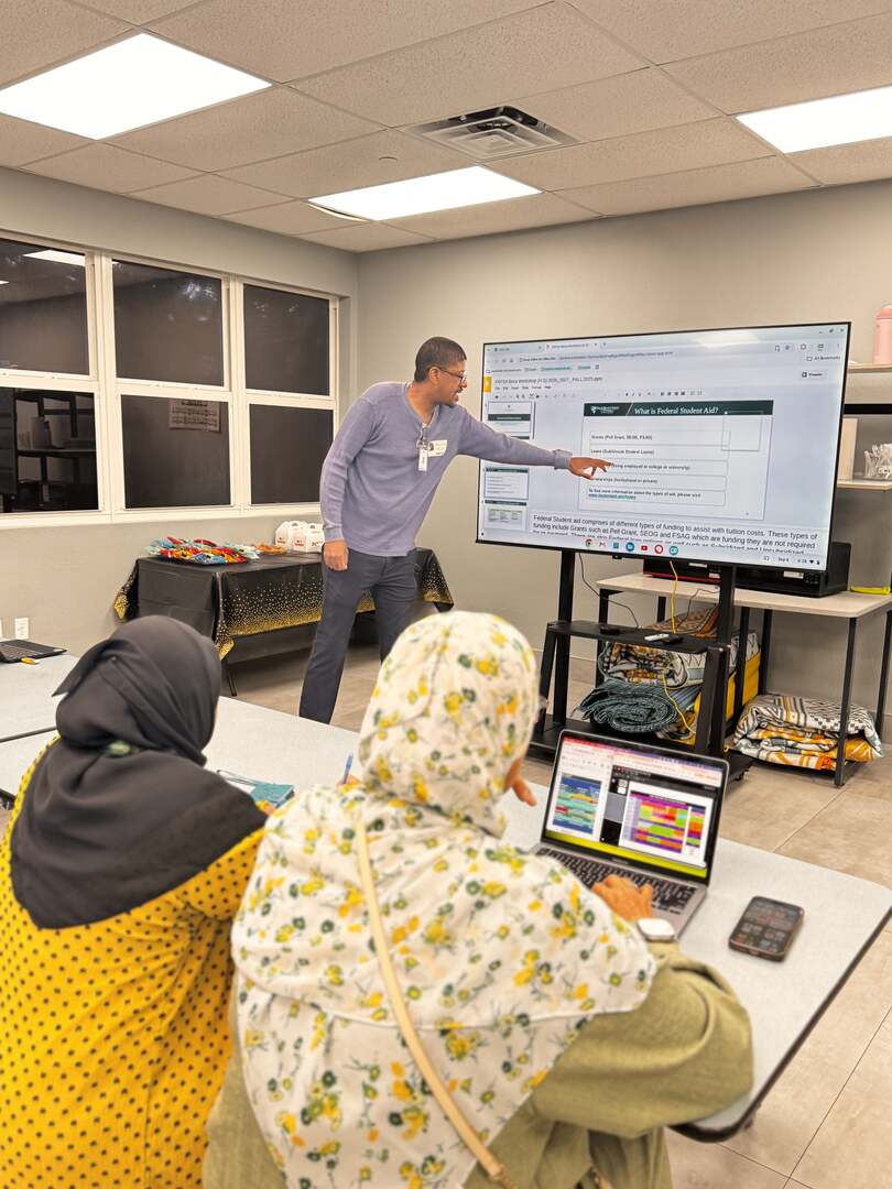 The presenter walking families through a slide titled "What is Federal Student Aid?"